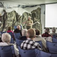 Naturalist giving a presentation in Hudson Theater at Mt. McKinley Princess Wilderness Lodge