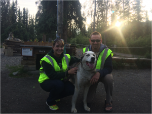 Two employees with their dog